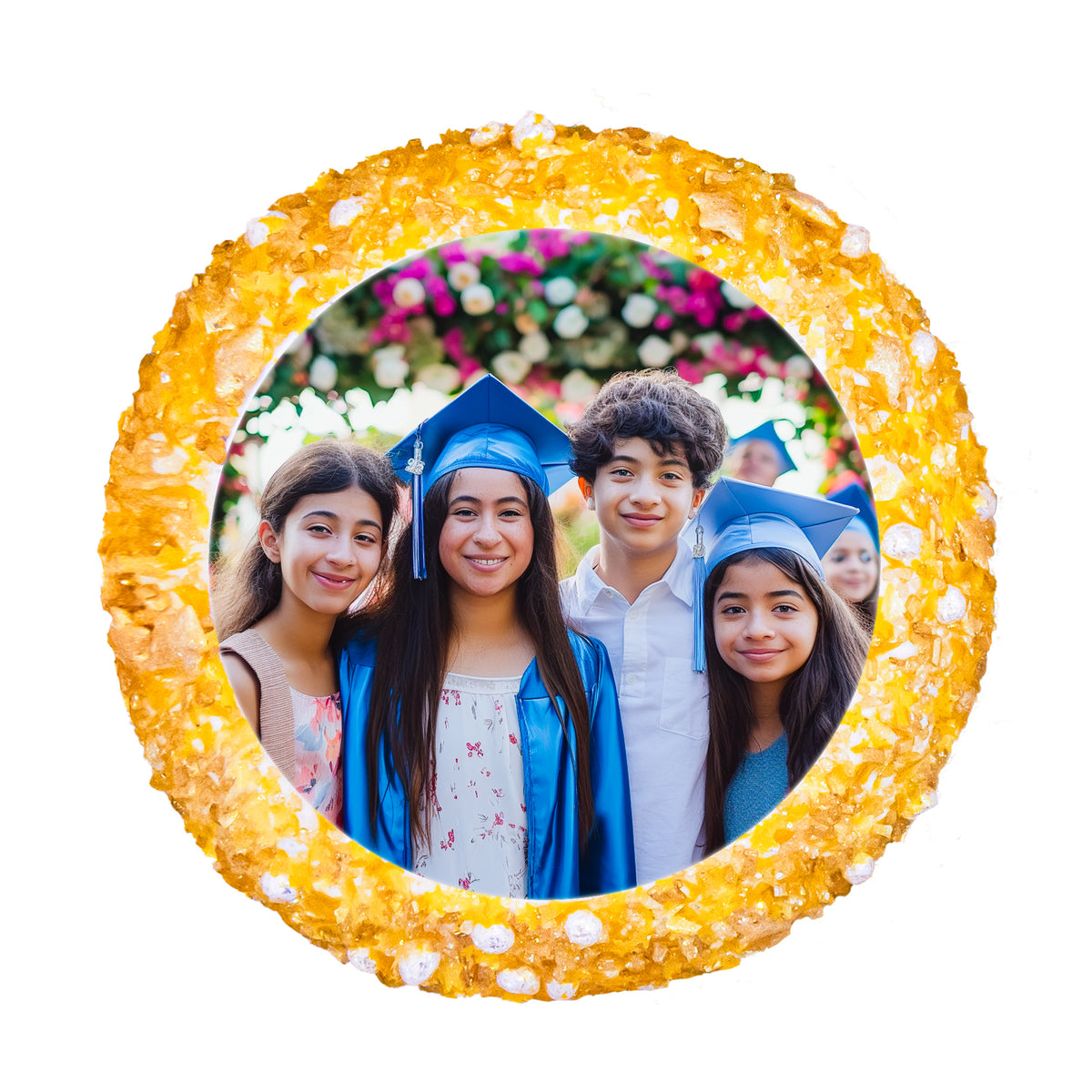 A cupcake topped with a printed graduation photo