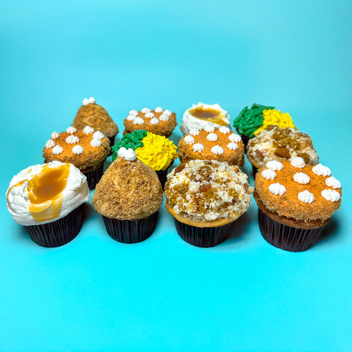 Trophy Thanksgiving dinner cupcakes on a blue table