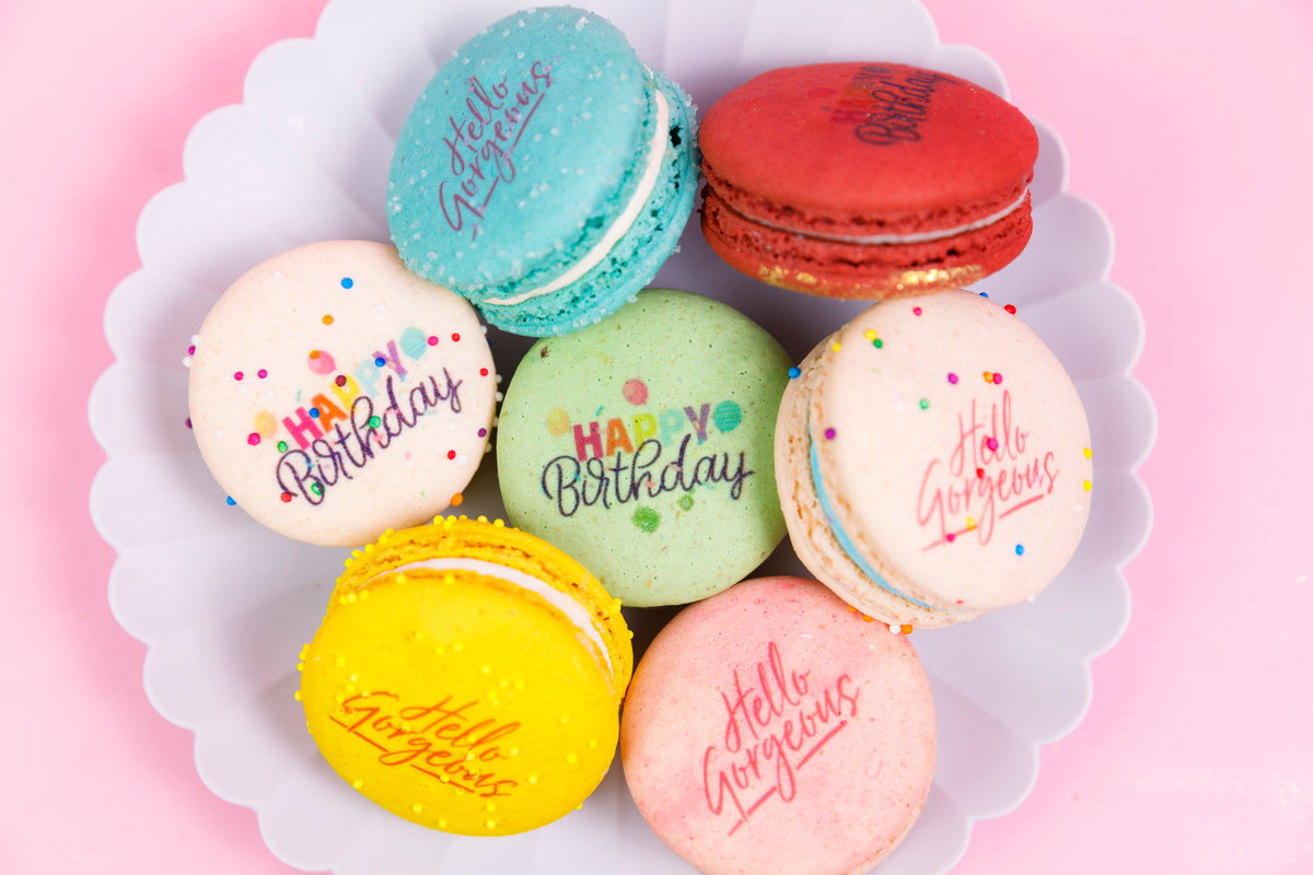 Pastel macarons printed with birthday greetings
