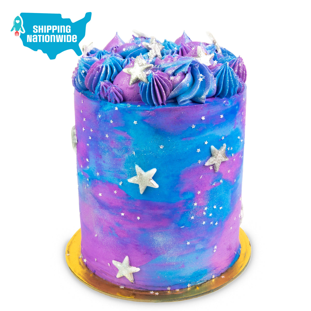 Galaxy Cake with blue and purple swirled buttercream and silver stars on a gold cake board, with a Shipping Nationwide badge