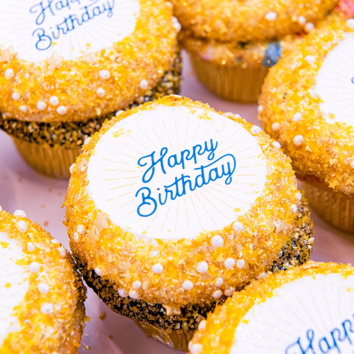 Custom Photo Cupcakes with printed Happy Birthday images and gold sugar borders