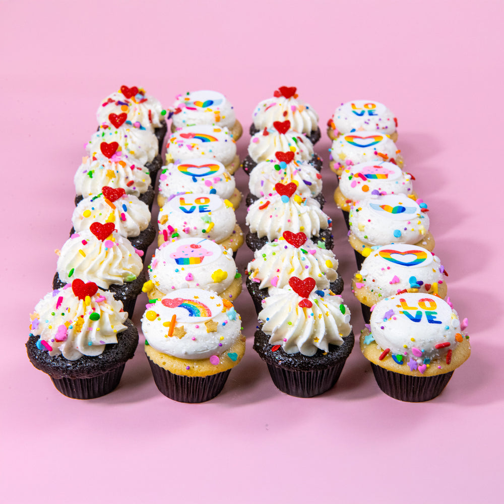 Rainbow Love Minis in four rows on a pink background, with red heart sprinkles and rainbow image toppers