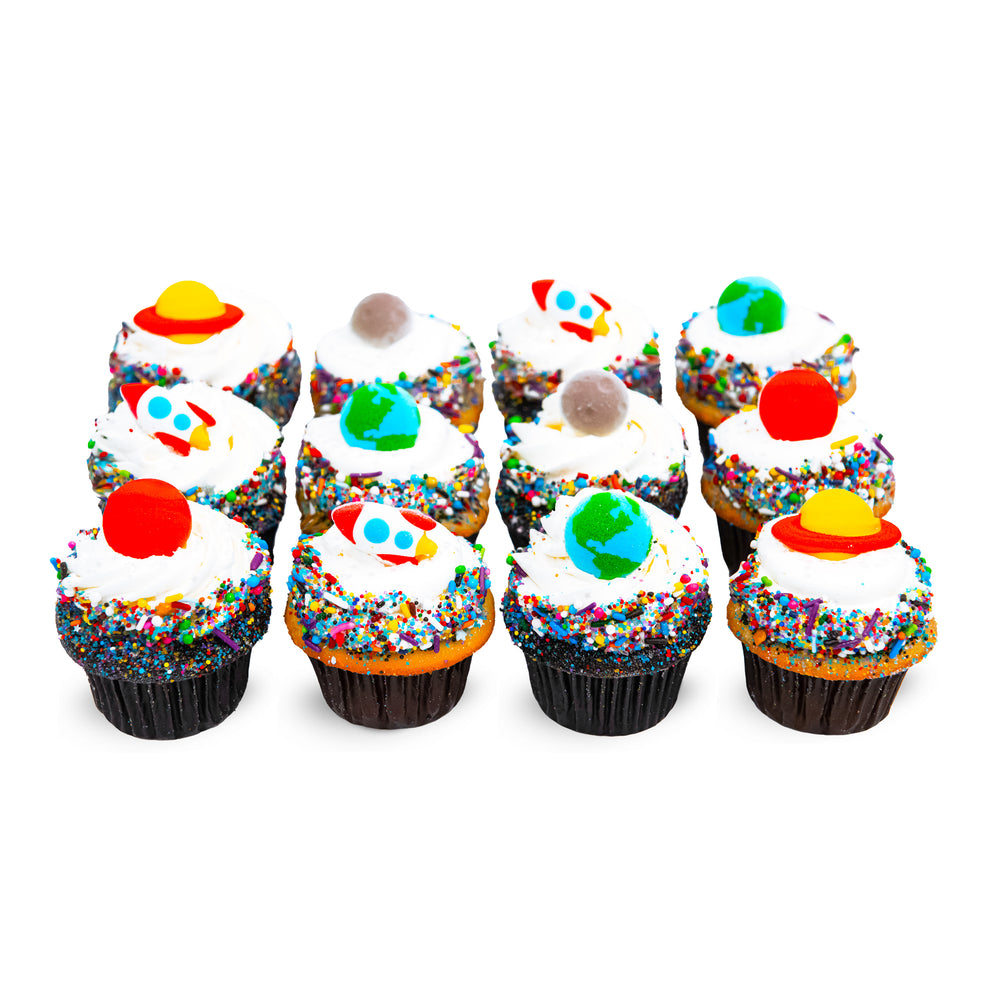 Space Party dozen cupcakes with sugar rockets, planets and moons on white frosting